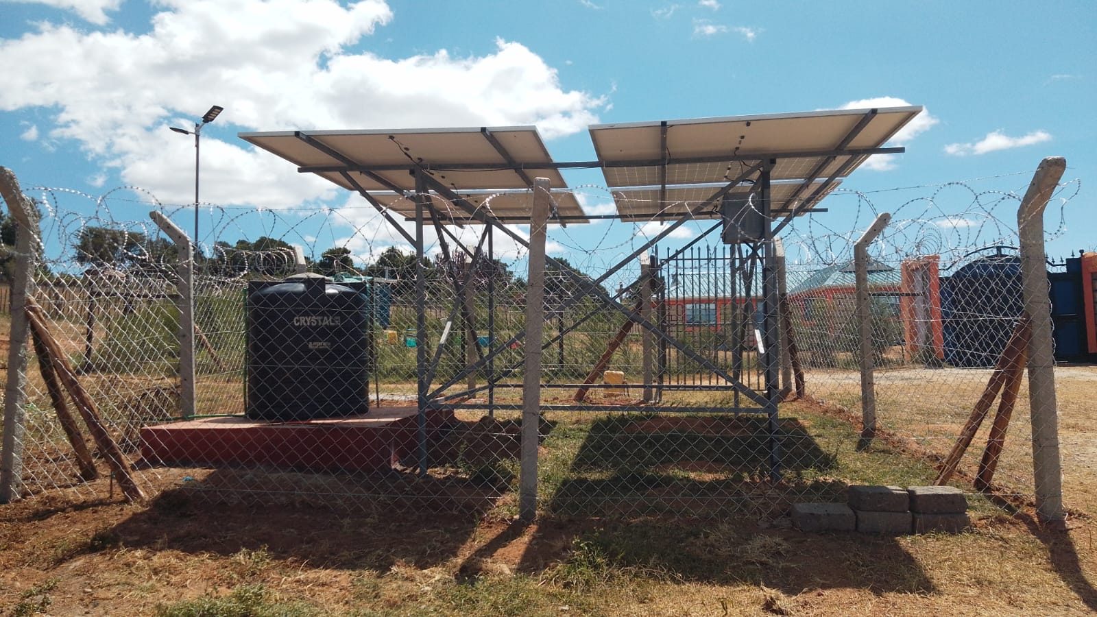 Chumvi community land with solar water system — future drip irrigation site